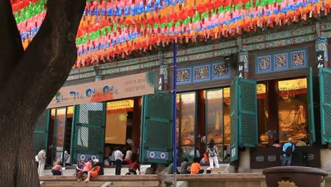 People bowing down to pray Buddha in temple Stock Footage