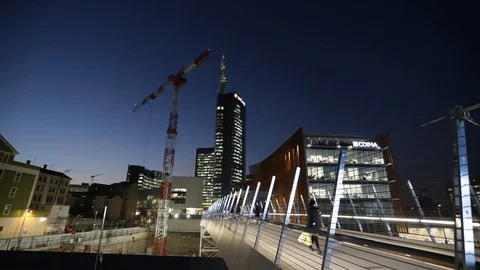 People on a bridge over a construction site at the Gae Aulenti square in time Stock Footage 103489358
