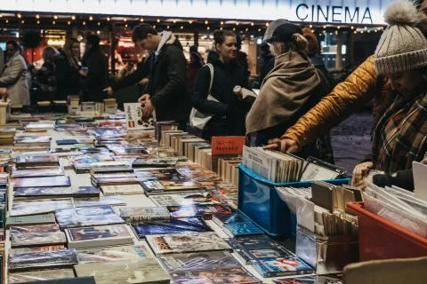 People browsing books at second hand book market in Southbank, London, UK, in Stock Photos