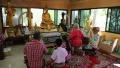 People in Buddhist temple on Pratumnak Hill near Golden Buddha statue in Pattaya HD Footage
