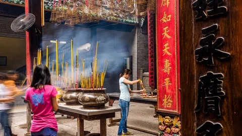 People burning incense at Ba Thien Hau pagoda, Ho Chi Minh City, Vietnam Stock-Footage 116860018