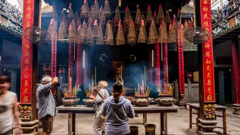 People burning incense at Ba Thien Hau pagoda, Ho Chi Minh City, Vietnam Stock-Footage 116860090
