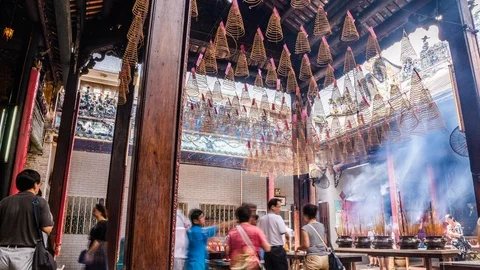 People burning incense at Ba Thien Hau pagoda, Ho Chi Minh City, Vietnam Stock Footage 116860217
