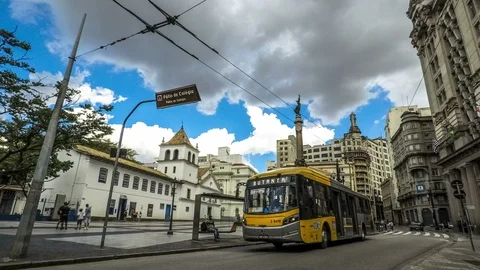 People in bus stop in pátio do Colégio square Stock Footage 88327245
