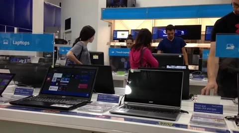 People buying new computer inside inside store Stock Footage 43857735