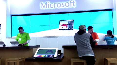 People buying new computer at Microsoft store check out counter 動画素材 67224071