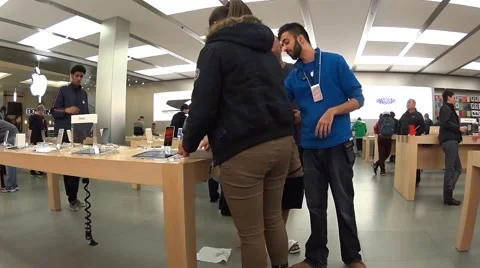 People buying new iphone inside apple store Stock Footage 43043282
