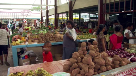 People buying produce at an open-air marketplace in Fiji Stock Footage 59532653