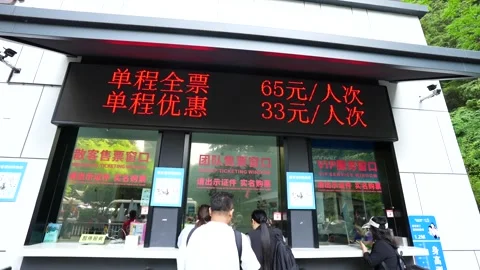 People buying tickets at the Bailong elevator ticket office in Zhangjiajie Stock Footage 341658610