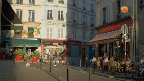 People in a cafe in Paris in the evening Stock Footage 231755059