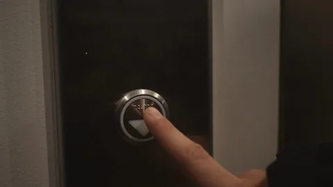 People call the elevator to move between floors. Stock Footage 98942155