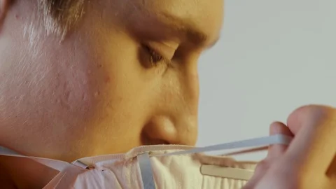 People can be infected with a deadly coronavirus study, close-up. jumpsuit Stock Footage 124530293
