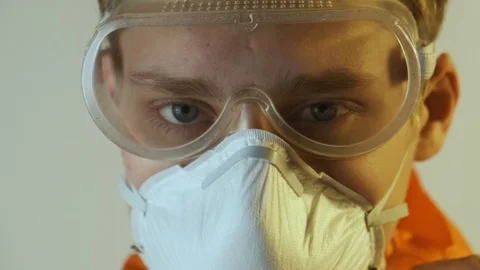 People can be infected with a deadly coronavirus study, close-up. jumpsuit Stock Footage 124530403