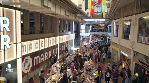 People can be seen exploring and shopping around the Central Market. Видео 271256275