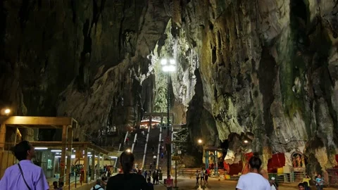 People can seen exploring and praying in the Hindu Temple in Batu Caves KL. Stock Footage 168501240