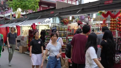 People can seen exploring and shopping around Chinatown Singapore. Видео 262445201