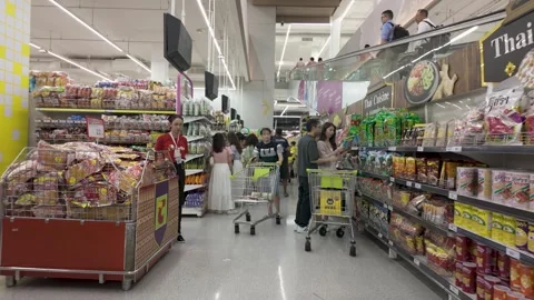 People can seen exploring and shopping around Big C retail hypermarket Видео 301421544