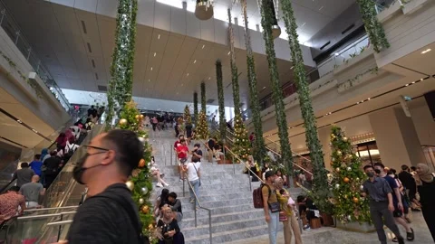 People can seen exploring around The Exchange TRX mall. 動画素材 257433886