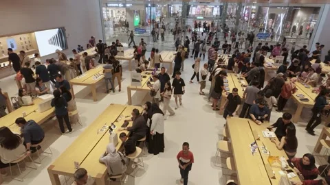 People can seen exploring around Apple The Exchange TRX. Stock Footage 280981920