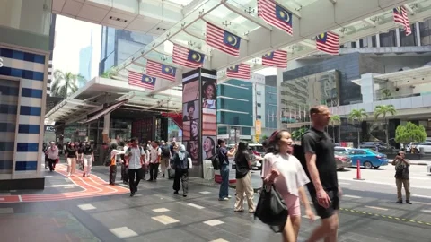 People can seen exploring around the area of Bukit Bintang, Malaysia. 動画素材 314898296