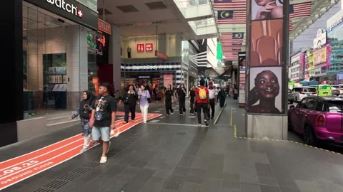 People can seen exploring around the area of Bukit Bintang, Malaysia. Видео 314991917