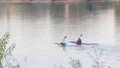 People canoeing on the river Stock Footage 106278800