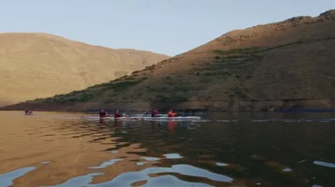 People in canoes in a dam Stock Footage
