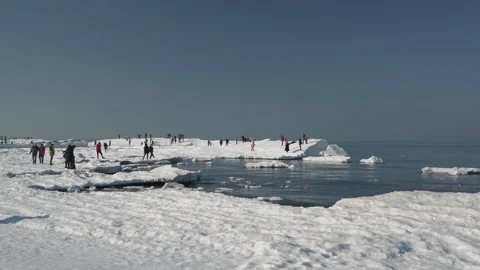 People carelessly walk on the spring ice, not realizing the danger Stock Footage 149305068