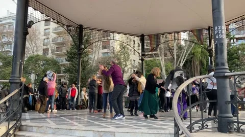 People casually dancing a folkloric argentine dance in Buenos Aires city Stock Footage 203625719
