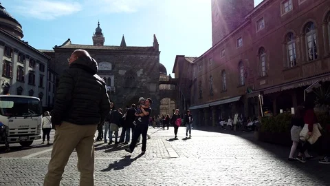 People casually walking in Piazza Vecchia Bergamo, Italy Stock Footage 106824454