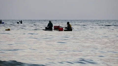People catch fish sitting in a canoe, fishing in the Andaman Sea. Vídeos de archivo 73617517