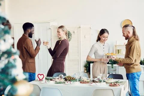 People Celebrating Christmas in Dining Room Stock Photos