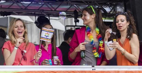 People celebrating on a large float attending the Gay Pride parade in Munich Stock-Fotos