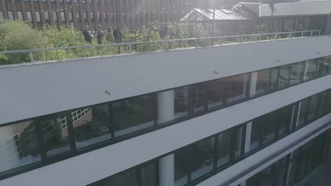 People Chatting On The Rooftop Garden - No LUT Version Stock Footage 221876953