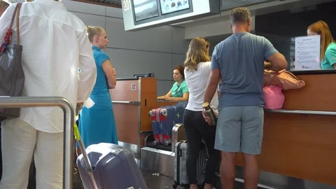 People Checking In For Flights Stock Footage 122523182