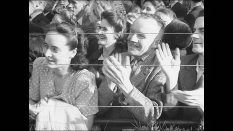 People cheering and clapping hands on Walthamstow stadium, London, UK, 1945 Video stock 159442029
