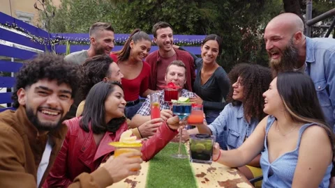 People cheers and having fun. Group of multiracial happy friends drinking and Stock Footage 180726037