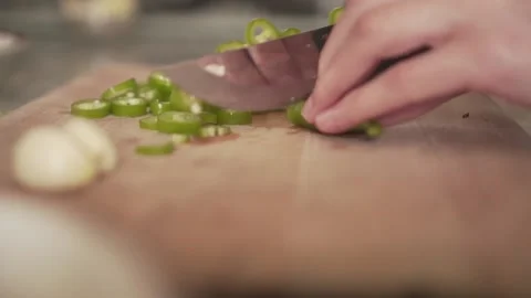 People chopping peppers in the kitchen Stock Footage