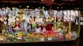 People at Christmas market early night and gingerbread hearts mobile shop 4k or 4k+ Resolution