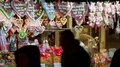 People at Christmas market early night and gingerbread hearts mobile shop 4k or 4k+ Resolution