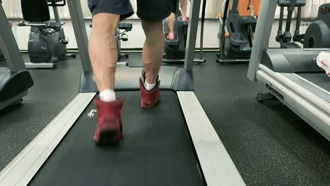 People clad in sneakers steps on the treadmill. Stock Footage 80394553