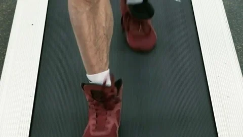 People clad in sneakers steps on the treadmill. Stock Footage 80394560
