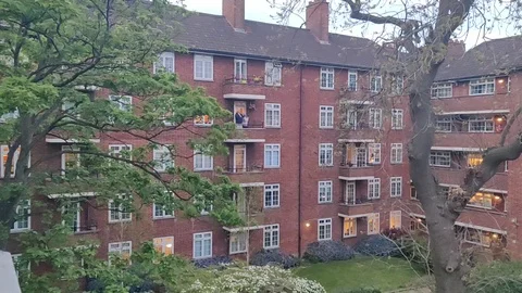 PEOPLE CLAPPING FOR NURSES AND ESSENTIAL WORKERS COVID19 LOCKDOWN UK Stock Footage 128543947