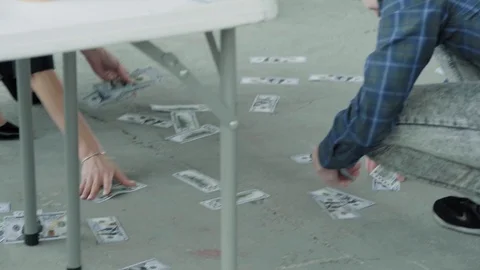 People clean money under the table. Business office. Scattered money. Coworking Stock Footage 124491721