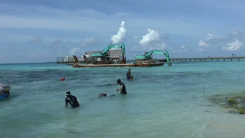 People Cleaning the sea from the garbage on the Construction site Stock Footage 125541062