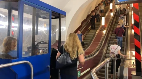 People climb up and down the subway escalator. Stock-Footage 115347169