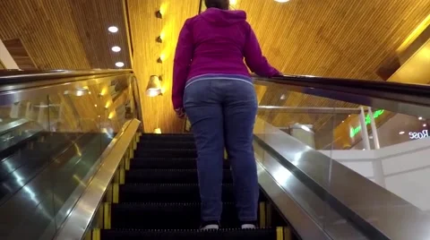 People climb the escalator Stock Footage 54365685