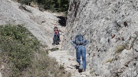 People climb up the steep steps to get to the top of the mountain, Spain Stock Footage 101270072