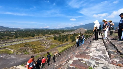 People climbing the middle section of the pyramid of the sun Stock Footage 97995836