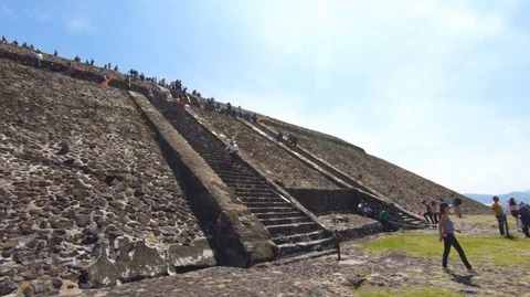 People climbing the middle section of the pyramid of the sun Stock Footage 97997442